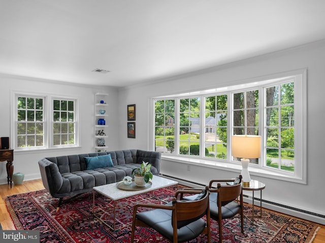 9103 Chickawane Ct, Alexandria, VA 22309 - living area featuring baseboard heating, light wood-style flooring, ornamental molding, and a baseboard heating unit