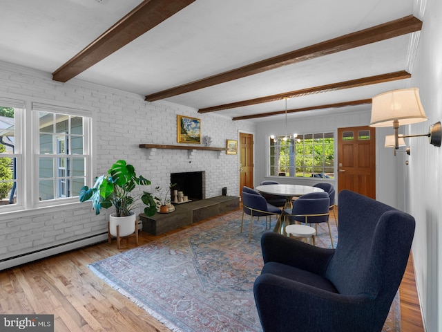 9103 Chickawane Ct, Alexandria, VA 22309 - living room with brick wall, beamed ceiling, wood finished floors, a baseboard radiator, and a fireplace