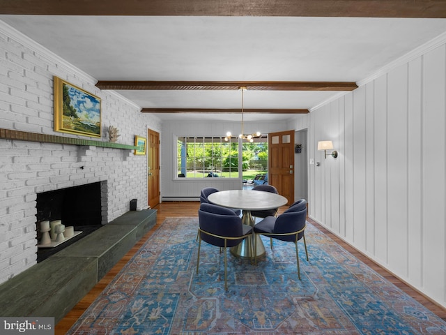 9103 Chickawane Ct, Alexandria, VA 22309 - dining room with beam ceiling, a chandelier, wood finished floors, a brick fireplace, and a baseboard radiator