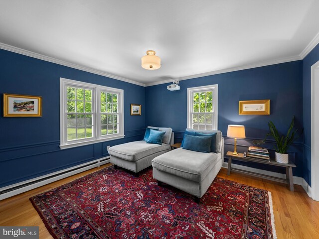9103 Chickawane Ct, Alexandria, VA 22309 - sitting room with ornamental molding, a baseboard radiator, wood finished floors, and baseboards