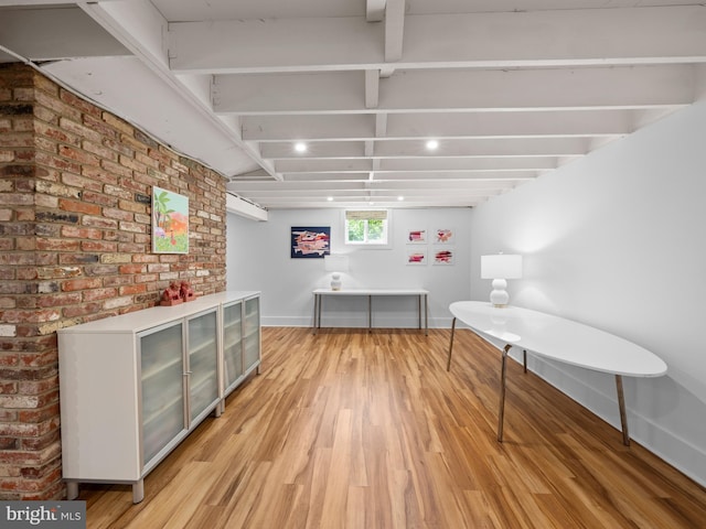 9103 Chickawane Ct, Alexandria, VA 22309 - bar area with light wood finished floors, baseboards, and brick wall
