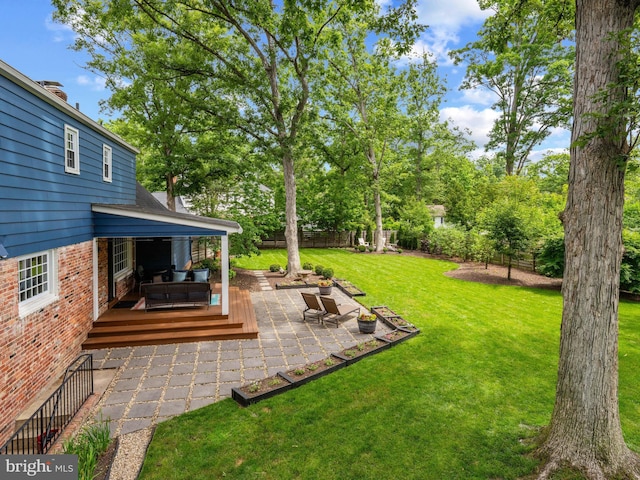 9103 Chickawane Ct, Alexandria, VA 22309 - view of yard featuring a deck and a patio