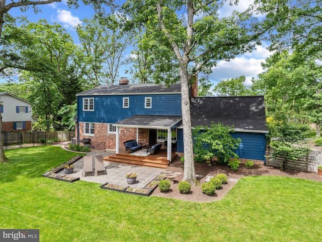 9103 Chickawane Ct, Alexandria, VA 22309 - rear view of property featuring a wooden deck, a shingled roof, a patio, and brick siding