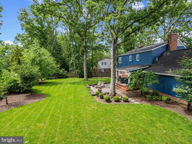 9103 Chickawane Ct, Alexandria, VA 22309 - view of yard featuring a patio and a wooden deck