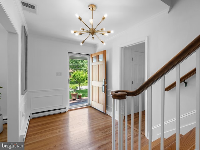9103 Chickawane Ct, Alexandria, VA 22309 - entrance foyer featuring a chandelier, ornamental molding, light wood finished floors, and a baseboard heating unit
