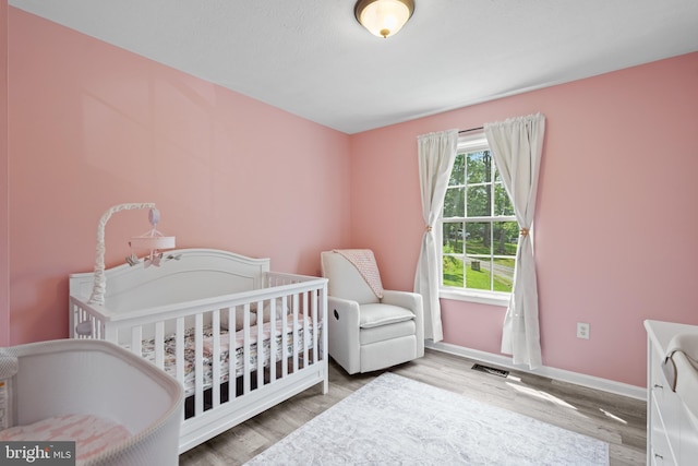 1971 High Top Rd, Linden, VA 22642 - bedroom with wood finished floors and a crib