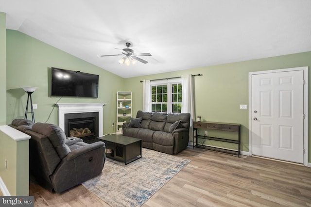 1971 High Top Rd, Linden, VA 22642 - living room featuring lofted ceiling, light wood finished floors, a ceiling fan, and a glass covered fireplace
