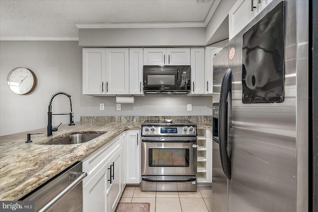 425 Robin Dr Unit 302, Ocean City, MD 21842 - kitchen with stainless steel appliances, a sink, light tile patterned flooring, white cabinetry, and ornamental molding