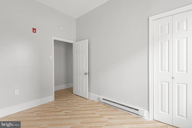 755 S 22nd St, Philadelphia, PA 19146 - empty room with a baseboard radiator, baseboards, and a smoke detector