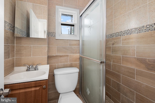 755 S 22nd St, Philadelphia, PA 19146 - full bath featuring vanity, tile walls, a stall shower, and toilet