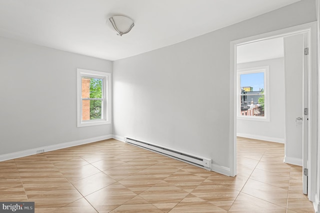 755 S 22nd St, Philadelphia, PA 19146 - unfurnished room featuring a baseboard heating unit, light tile patterned floors, and baseboards