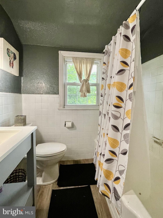 1506 Mcgovern Ter, Wilmington, DE 19805 - full bathroom with tile walls, toilet, a textured ceiling, shower / tub combo with curtain, and vanity