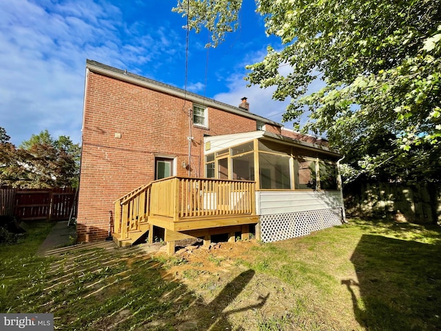 1506 Mcgovern Ter, Wilmington, DE 19805 - back of house featuring a sunroom, a chimney, brick siding, a deck, and stairs