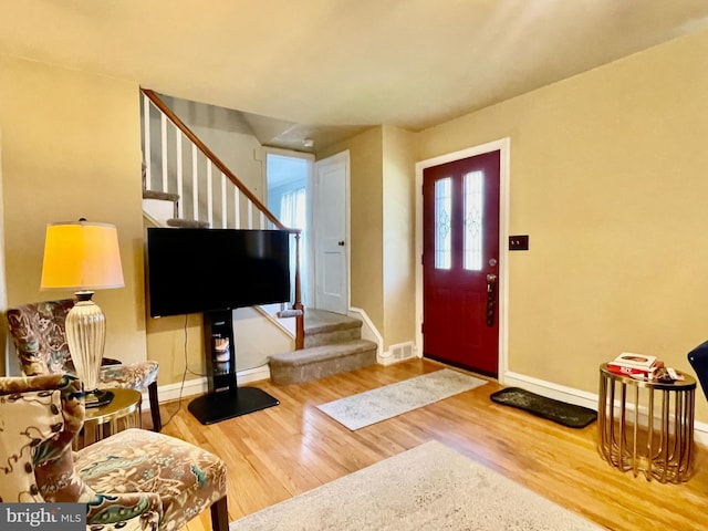 1506 Mcgovern Ter, Wilmington, DE 19805 - entrance foyer with stairway, wood finished floors, and baseboards