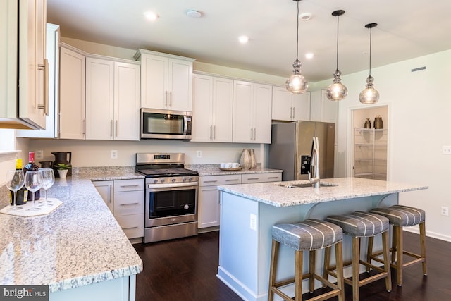 TBD Melia Court, Parkville, MD 21234 - kitchen with stainless steel appliances, dark wood-style flooring, a center island with sink, light stone countertops, and recessed lighting