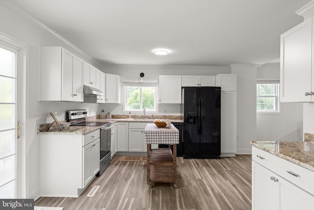 1164 Fairfax Pike, White Post, VA 22663 - kitchen with black fridge with ice dispenser, stainless steel range with electric cooktop, under cabinet range hood, a sink, and light wood finished floors