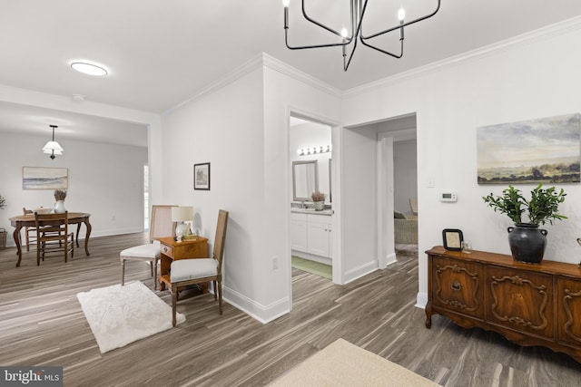 1164 Fairfax Pike, White Post, VA 22663 - sitting room with wood finished floors, ornamental molding, baseboards, and a chandelier