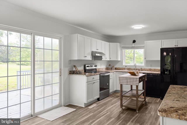 1164 Fairfax Pike, White Post, VA 22663 - kitchen with black appliances, under cabinet range hood, light wood-type flooring, white cabinets, and crown molding