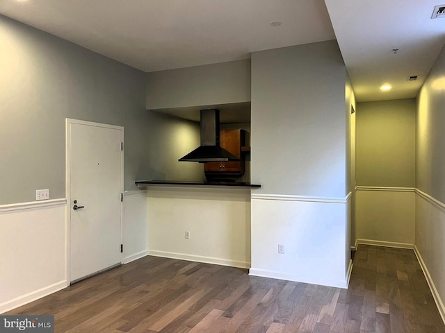 1211 Light St Unit 105, Baltimore, MD 21230 - kitchen with wall chimney range hood, wood finished floors, and baseboards