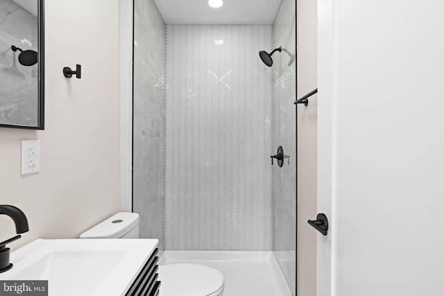 1728 S Bancroft St, Philadelphia, PA 19145 - bathroom with toilet, vanity, a tile shower, and recessed lighting