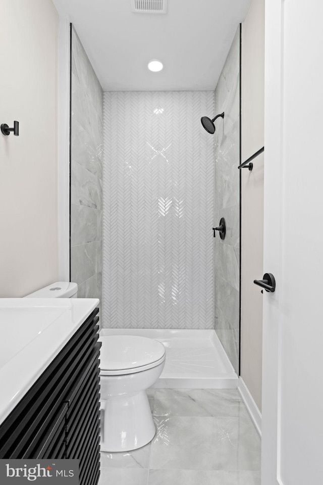 1728 S Bancroft St, Philadelphia, PA 19145 - full bath with toilet, marble finish flooring, vanity, a tile shower, and recessed lighting
