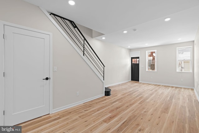 1728 S Bancroft St, Philadelphia, PA 19145 - unfurnished living room with stairs, light wood-style flooring, recessed lighting, and baseboards