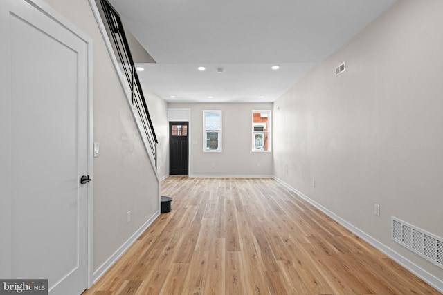 1728 S Bancroft St, Philadelphia, PA 19145 - empty room with light wood finished floors, stairs, baseboards, and recessed lighting