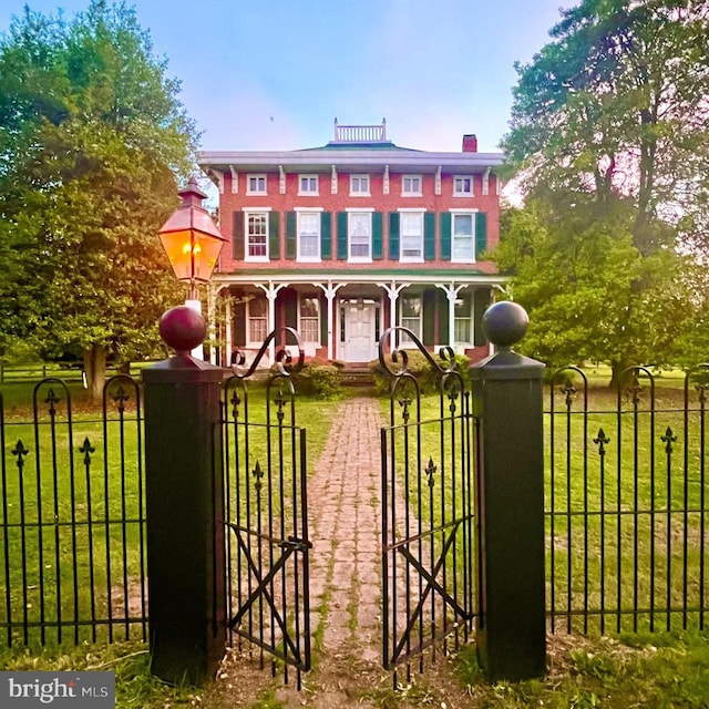 3394 State Hill Rd, Reading, PA 19608 - italianate-style house with covered porch, a gate, and a chimney