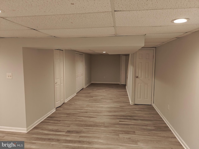 3910 Gatehouse Ln, Skippack, PA 19474 - finished basement featuring a paneled ceiling, light wood-type flooring, and baseboards