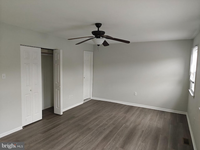 3910 Gatehouse Ln, Skippack, PA 19474 - unfurnished bedroom with dark wood-style flooring, baseboards, a closet, and a ceiling fan
