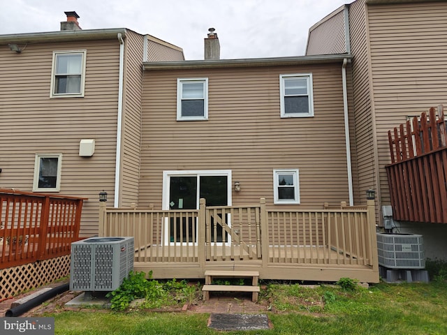 3910 Gatehouse Ln, Skippack, PA 19474 - rear view of house with central AC unit, a wooden deck, and a chimney