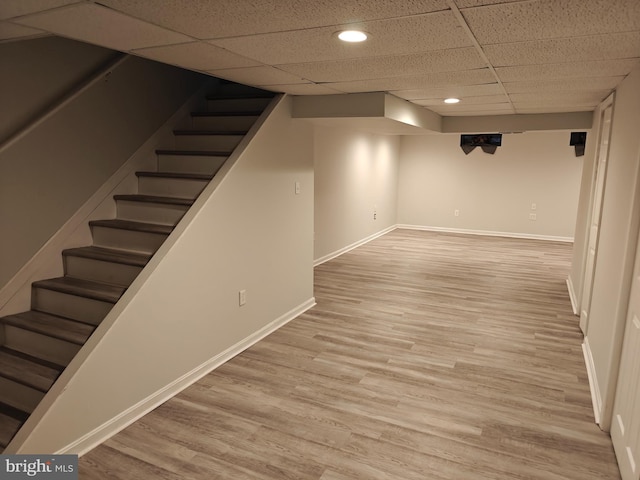 3910 Gatehouse Ln, Skippack, PA 19474 - finished below grade area with stairs, a paneled ceiling, baseboards, light wood-style floors, and recessed lighting