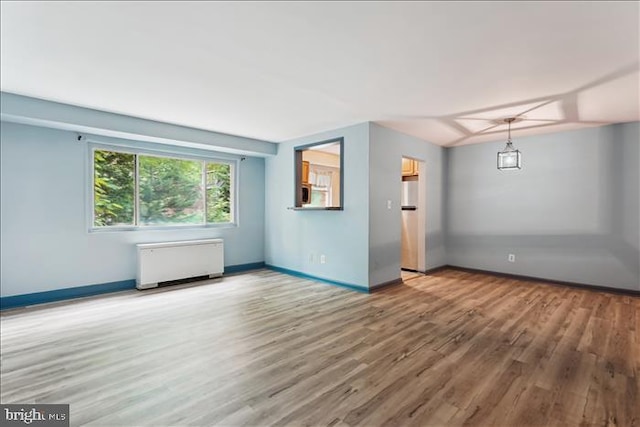 116 Lee Ave Unit 112, Takoma Park, MD 20912 - unfurnished living room with radiator, wood finished floors, and baseboards