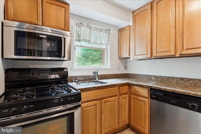 116 Lee Ave Unit 112, Takoma Park, MD 20912 - kitchen with stainless steel appliances, a sink, and dark stone counters