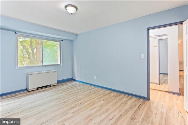 116 Lee Ave Unit 112, Takoma Park, MD 20912 - spare room with radiator, wood finished floors, and baseboards