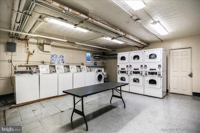 116 Lee Ave Unit 112, Takoma Park, MD 20912 - community laundry room featuring estacked washer and dryer, washer and dryer, and light floors