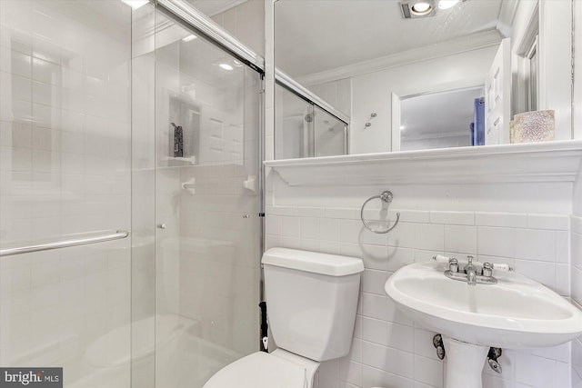 6801 Atlantic Ave Unit 2, Ocean City, MD 21842 - full bathroom with ornamental molding, toilet, a shower stall, a sink, and tile walls
