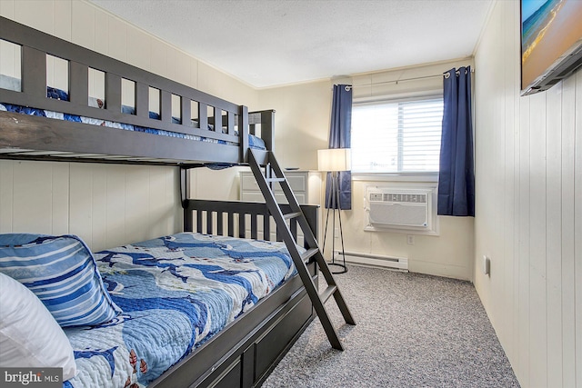 6801 Atlantic Ave Unit 2, Ocean City, MD 21842 - bedroom featuring carpet, baseboard heating, wood walls, and a textured ceiling
