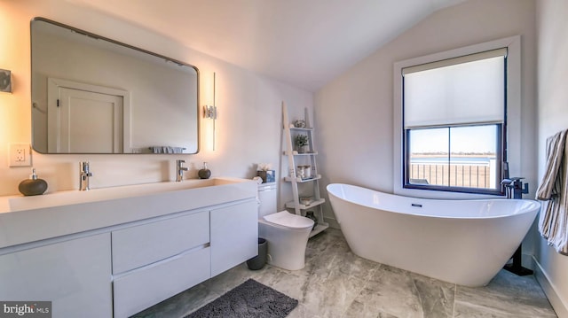 21 Hart Ln, Ventnor City, NJ 08406 - bathroom with vaulted ceiling, vanity, a freestanding bath, marble finish flooring, and toilet
