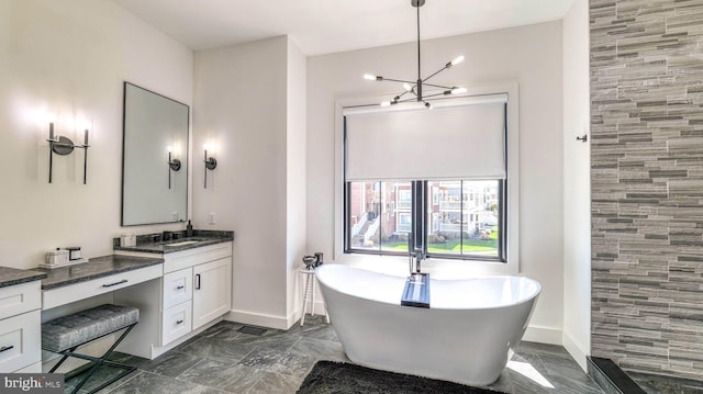 21 Hart Ln, Ventnor City, NJ 08406 - full bath featuring vanity, a freestanding tub, baseboards, and a chandelier
