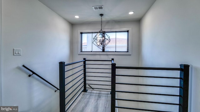 21 Hart Ln, Ventnor City, NJ 08406 - stairs with a chandelier, wood finished floors, and recessed lighting