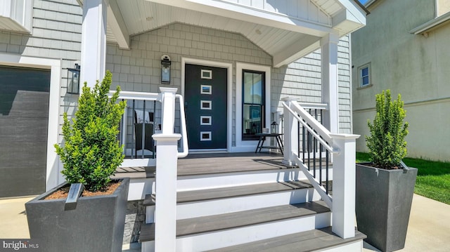 21 Hart Ln, Ventnor City, NJ 08406 - property entrance featuring covered porch and board and batten siding