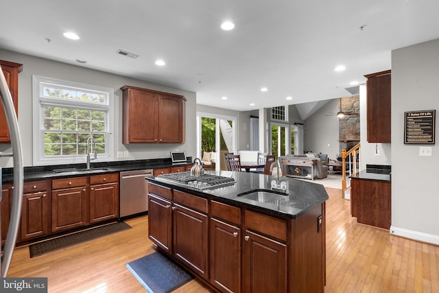 8800 Primula Dr, Laytonsville, MD 20882 - kitchen with stainless steel appliances, a sink, a center island, light wood finished floors, and recessed lighting