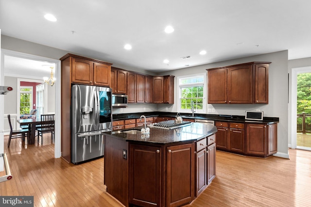 8800 Primula Dr, Laytonsville, MD 20882 - kitchen featuring stainless steel appliances, a sink, light wood finished floors, healthy amount of natural light, and recessed lighting