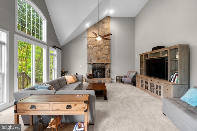 8800 Primula Dr, Laytonsville, MD 20882 - carpeted living room with high vaulted ceiling, plenty of natural light, ceiling fan, and a fireplace