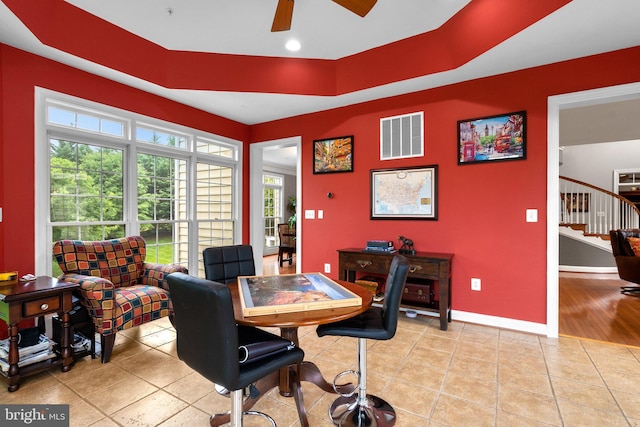 8800 Primula Dr, Laytonsville, MD 20882 - dining area with a ceiling fan, stairway, tile patterned floors, baseboards, and a tray ceiling