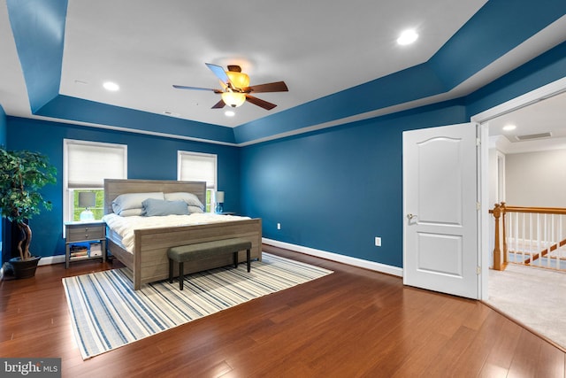 8800 Primula Dr, Laytonsville, MD 20882 - bedroom featuring a tray ceiling, wood finished floors, baseboards, and a ceiling fan