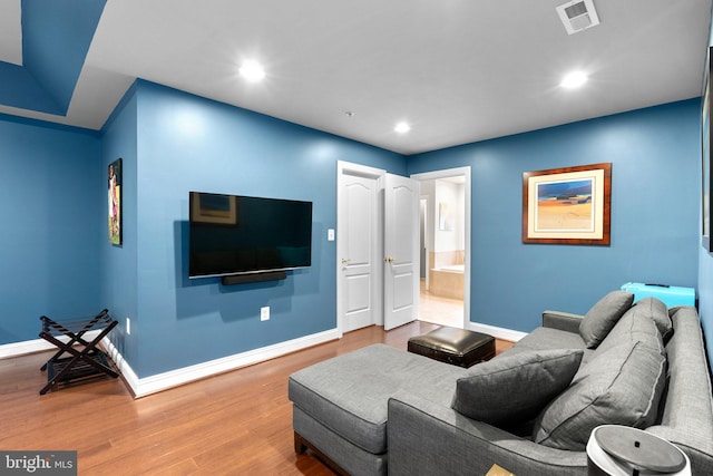 8800 Primula Dr, Laytonsville, MD 20882 - living room featuring wood finished floors, baseboards, and recessed lighting