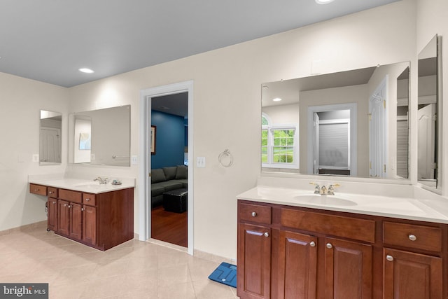 8800 Primula Dr, Laytonsville, MD 20882 - bathroom featuring ensuite bath, two vanities, tile patterned flooring, and baseboards