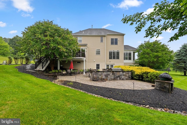 8800 Primula Dr, Laytonsville, MD 20882 - back of house featuring stairway, a patio, and a lawn
